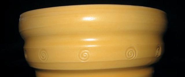 Yellow spiral-decorated bowl